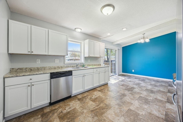 8040 Xenia Ave N, Brooklyn Park, MN 55443 - kitchen featuring dishwasher, a sink, a textured ceiling, white cabinetry, and stone finish flooring