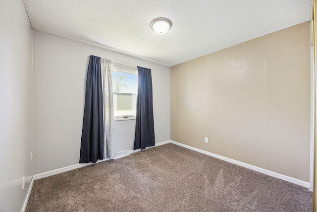 8040 Xenia Ave N, Brooklyn Park, MN 55443 - carpeted empty room featuring baseboards and a textured ceiling