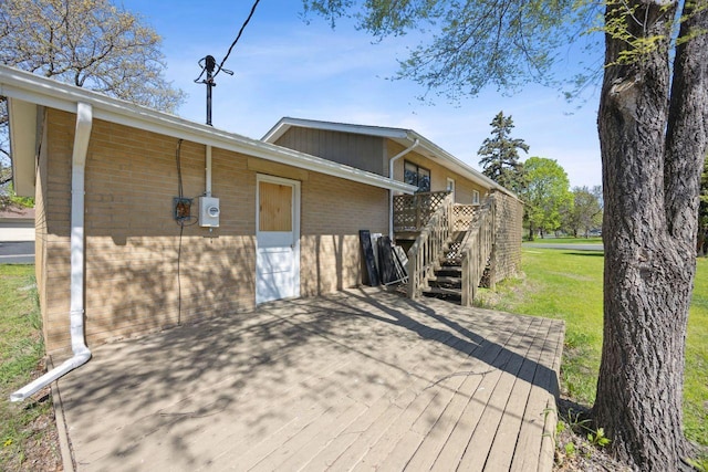 8040 Xenia Ave N, Brooklyn Park, MN 55443 - wooden terrace featuring a lawn and stairway