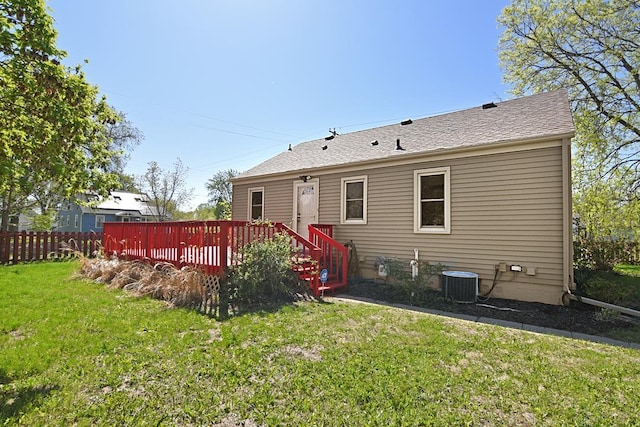 back of house featuring cooling unit and a deck