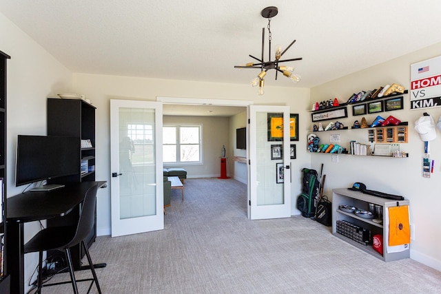 interior space featuring french doors, baseboards, and a notable chandelier