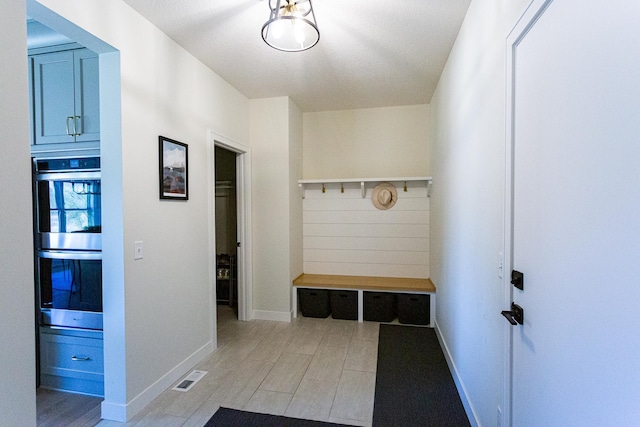 mudroom featuring visible vents and baseboards