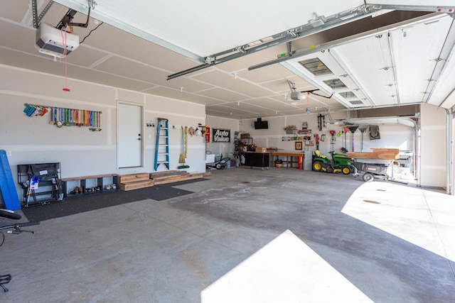garage featuring a workshop area and a garage door opener