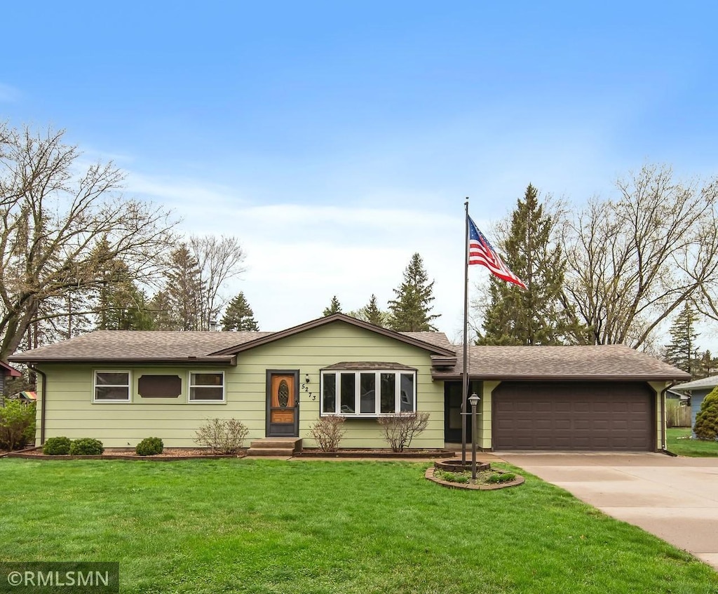 5273 Irondale Rd, Mounds View, MN 55112 - single story home featuring an attached garage, a shingled roof, driveway, and a front yard