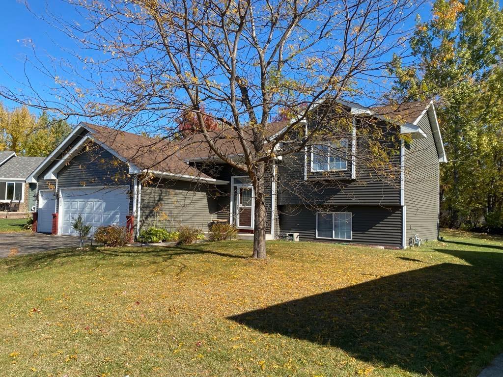 1312 Widgeon Way, Buffalo, MN 55313 - view of front of property with a garage, a front lawn, and driveway