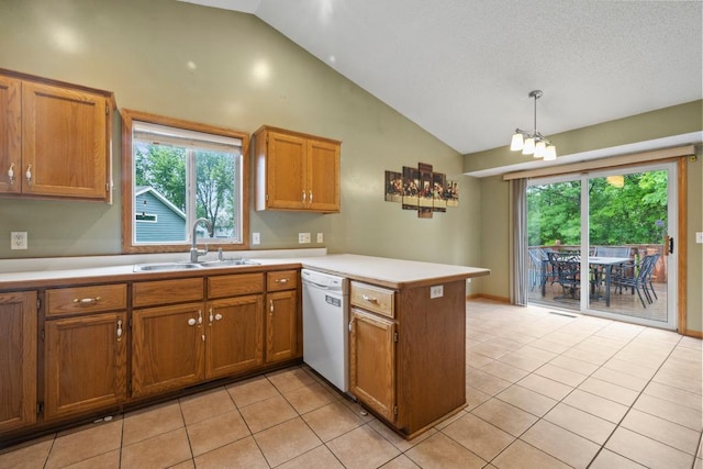 1312 Widgeon Way, Buffalo, MN 55313 - kitchen with white dishwasher, a peninsula, brown cabinets, light countertops, and high vaulted ceiling