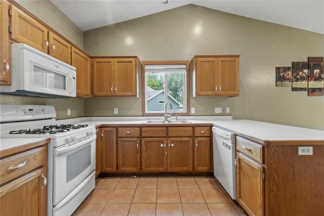 1312 Widgeon Way, Buffalo, MN 55313 - kitchen featuring white appliances, a peninsula, vaulted ceiling, brown cabinets, and light tile patterned floors