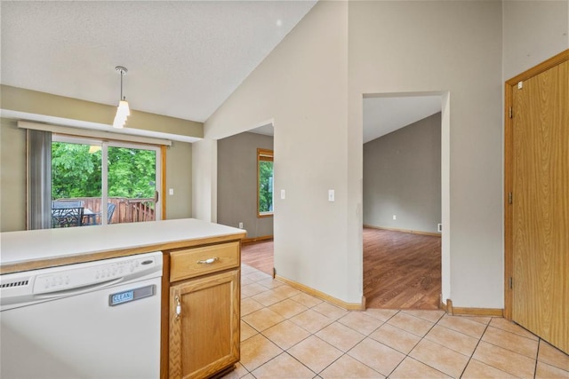1312 Widgeon Way, Buffalo, MN 55313 - kitchen with dishwasher, light tile patterned floors, pendant lighting, light countertops, and high vaulted ceiling