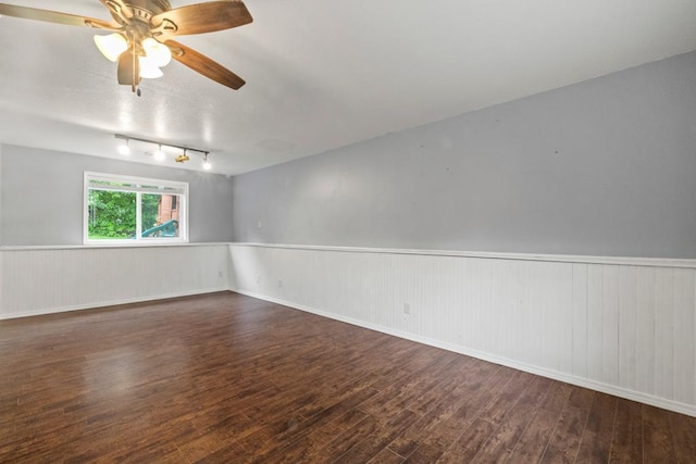 1312 Widgeon Way, Buffalo, MN 55313 - empty room featuring wood-type flooring, a wainscoted wall, and a ceiling fan