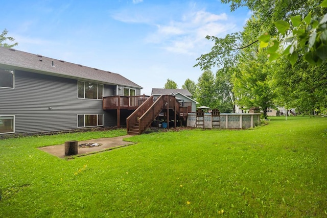 1312 Widgeon Way, Buffalo, MN 55313 - view of green lawn with a wooden deck, stairway, an outdoor pool, and an outdoor fire pit