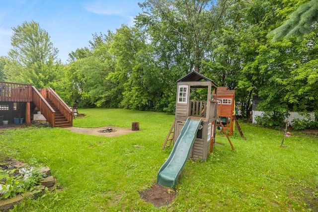 1312 Widgeon Way, Buffalo, MN 55313 - view of jungle gym featuring a lawn, stairs, an outdoor fire pit, and a deck