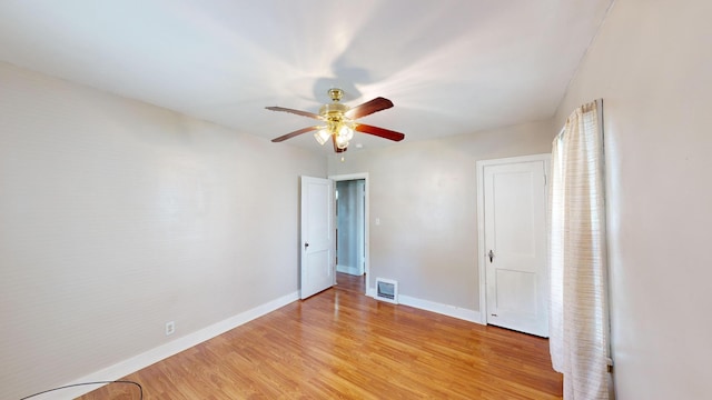 unfurnished bedroom with visible vents, baseboards, ceiling fan, and light wood-style floors