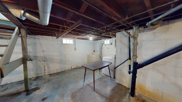 basement featuring washing machine and clothes dryer