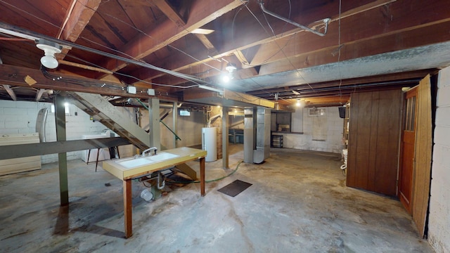unfinished basement featuring water heater, heating unit, and stairs