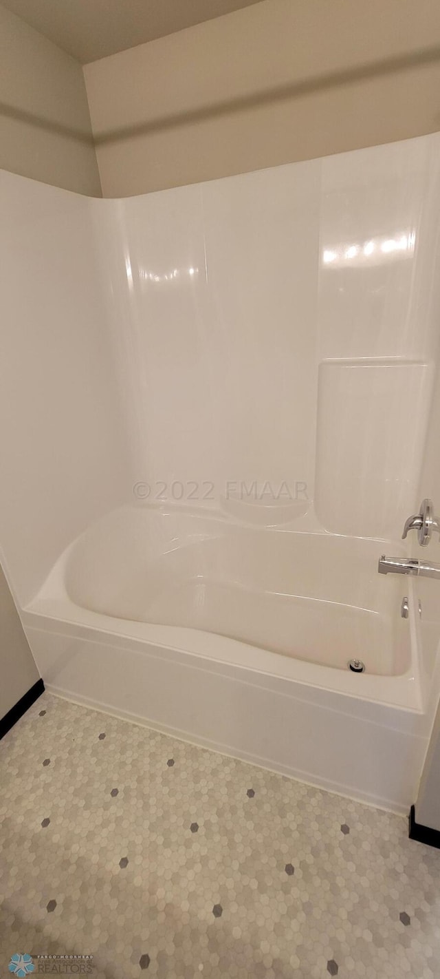bathroom featuring  shower combination