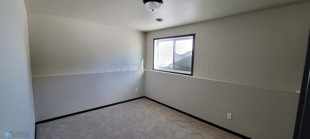 view of carpeted spare room