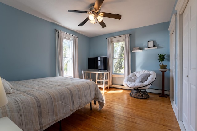 bedroom with wood finished floors and ceiling fan