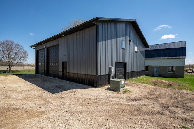 exterior space featuring an outbuilding and a detached garage