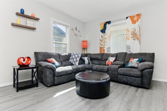 living area featuring wood finished floors and baseboards