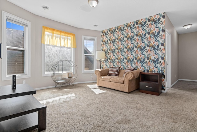 carpeted living room with baseboards