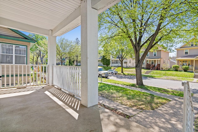 view of patio / terrace featuring a porch and a residential view