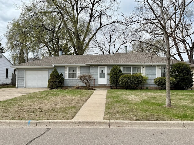 ranch-style home featuring concrete driveway, a front yard, a shingled roof, and a garage