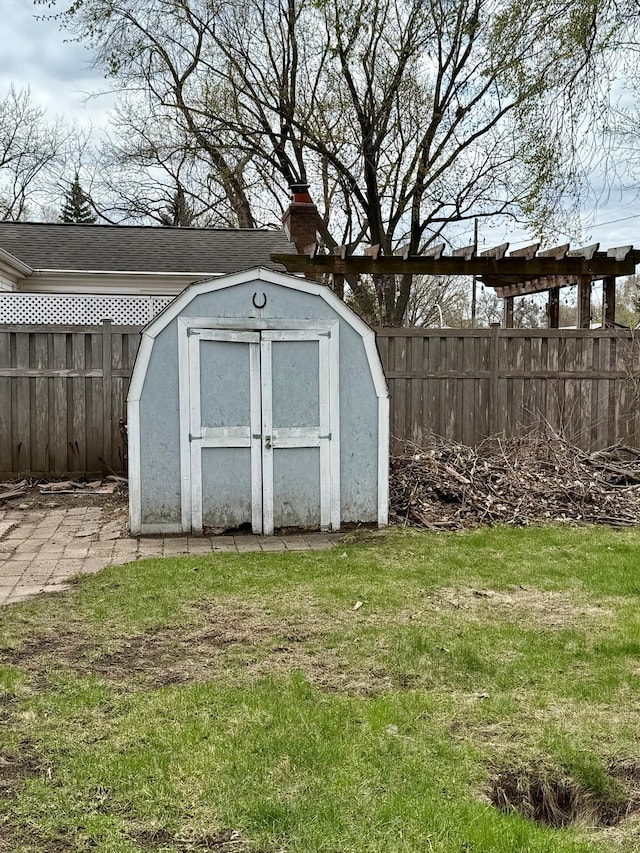 view of shed featuring a fenced backyard