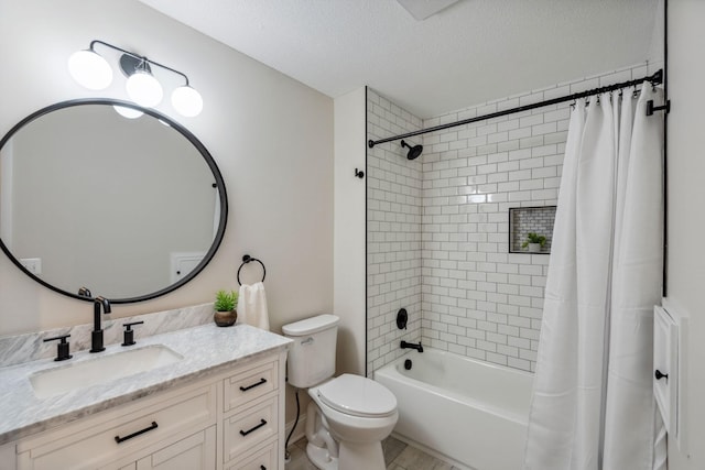 full bath featuring shower / bath combination with curtain, toilet, vanity, and a textured ceiling