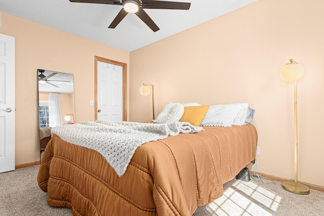 bedroom with baseboards, ceiling fan, and carpet flooring