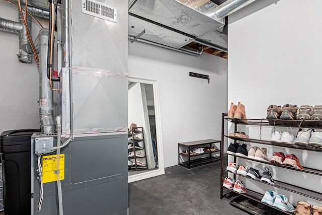 interior space with heating unit and visible vents
