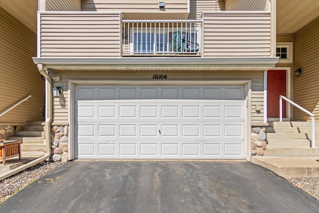 garage featuring aphalt driveway