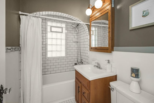 full bath featuring shower / bathtub combination with curtain, vanity, and toilet