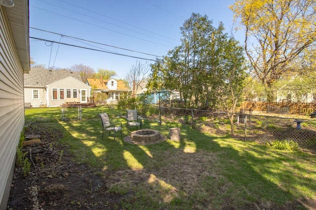 view of yard with an outdoor fire pit