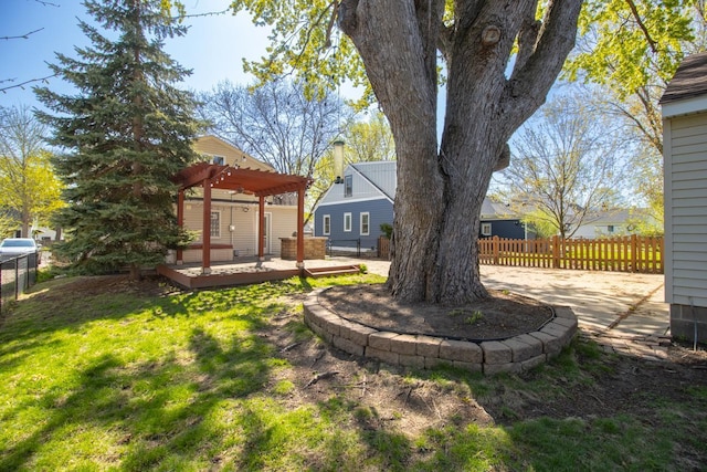 view of yard with a deck and a pergola