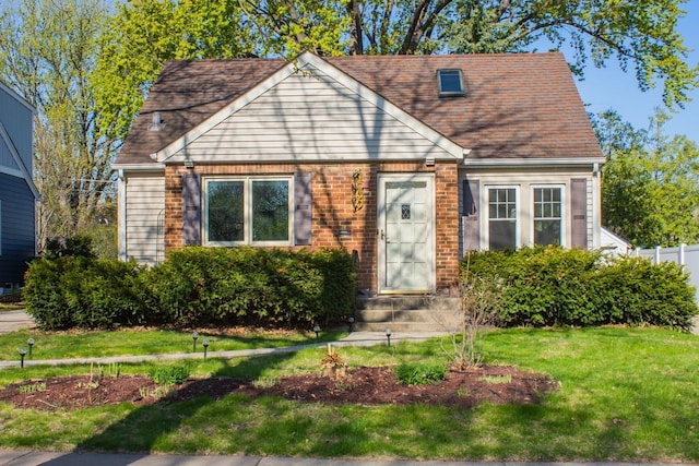 view of front of home featuring entry steps and a shingled roof