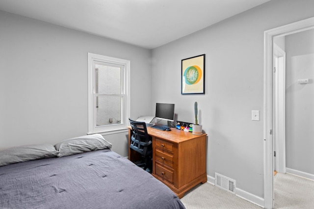 carpeted bedroom featuring visible vents and baseboards
