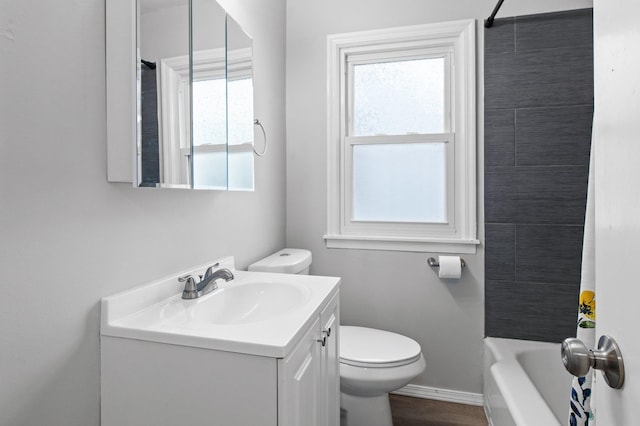 bathroom with vanity, shower / bathing tub combination, and toilet