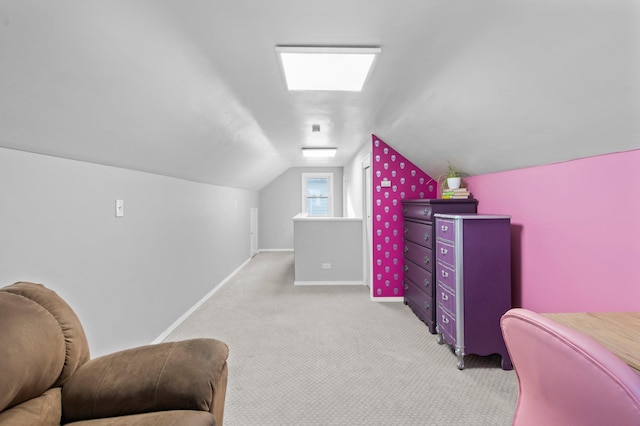 carpeted bedroom featuring baseboards and lofted ceiling