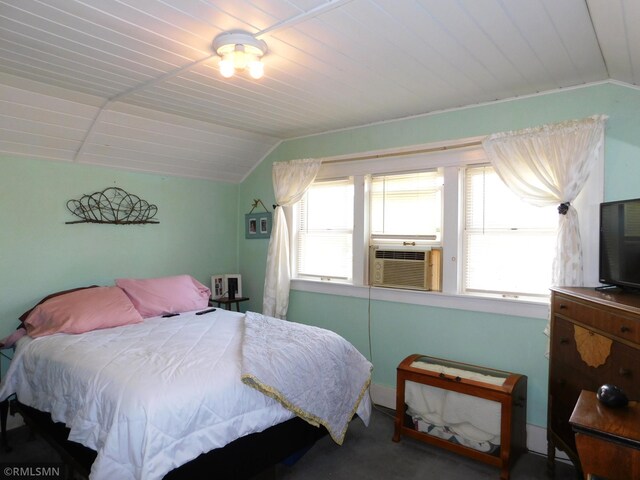 carpeted bedroom with wood ceiling, vaulted ceiling, and multiple windows