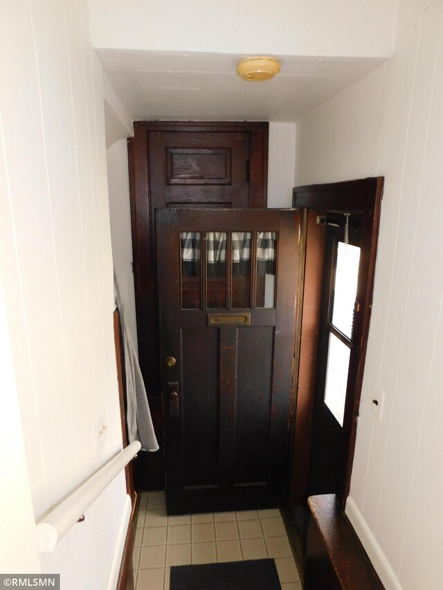 entryway with light tile patterned floors