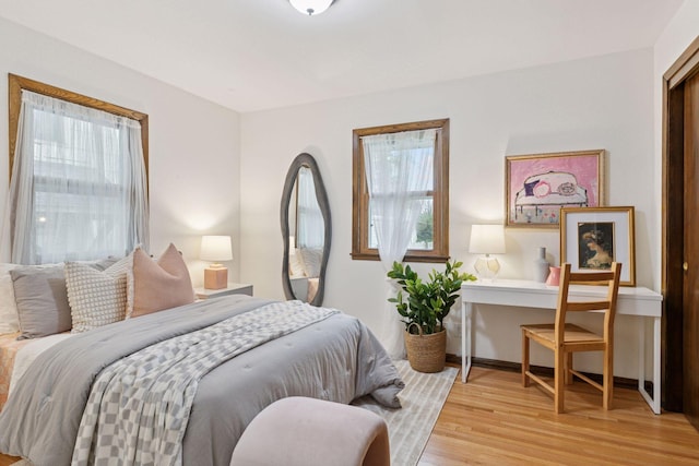 bedroom with light wood finished floors