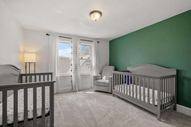 bedroom with carpet flooring and baseboards