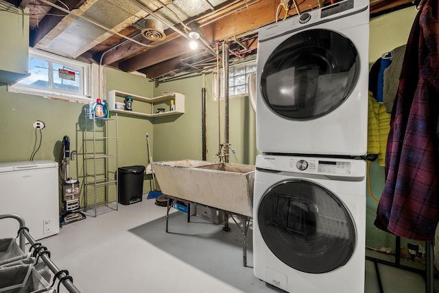 laundry room with laundry area and stacked washer / drying machine