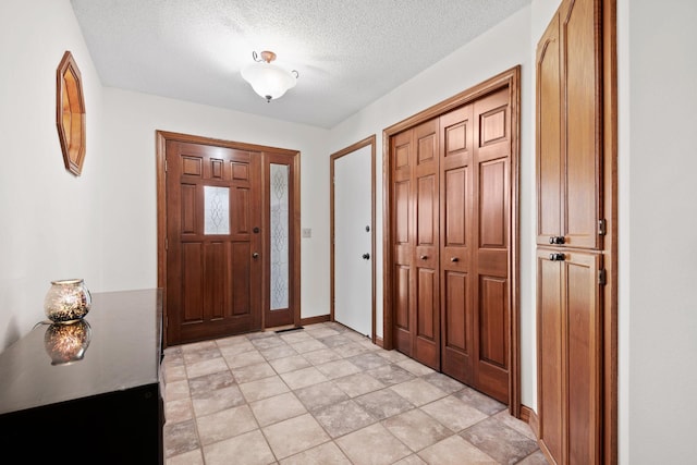 612 19th St N, Sartell, MN 56377 - entryway with a textured ceiling and baseboards