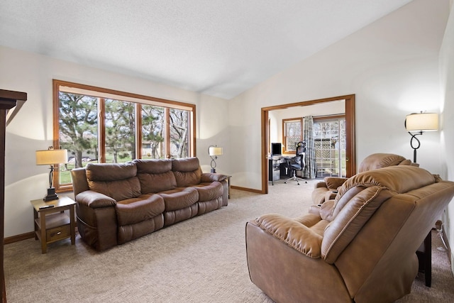 612 19th St N, Sartell, MN 56377 - living area with light colored carpet, vaulted ceiling, and baseboards