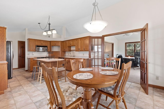 612 19th St N, Sartell, MN 56377 - dining space with lofted ceiling and baseboards