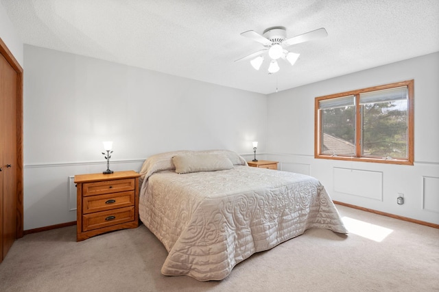 612 19th St N, Sartell, MN 56377 - bedroom featuring light colored carpet, baseboards, a ceiling fan, and a textured ceiling