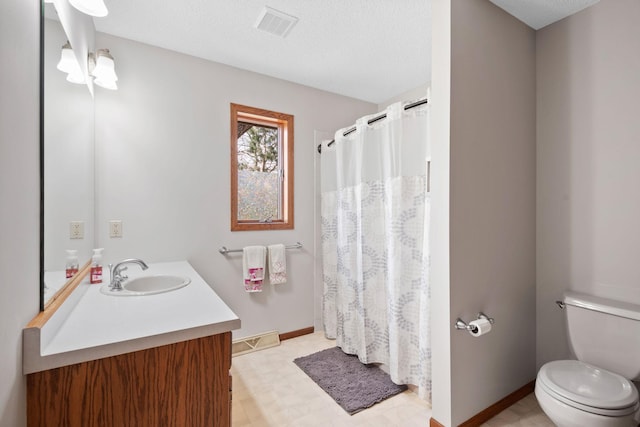612 19th St N, Sartell, MN 56377 - full bathroom featuring vanity, tile patterned floors, toilet, visible vents, and baseboards