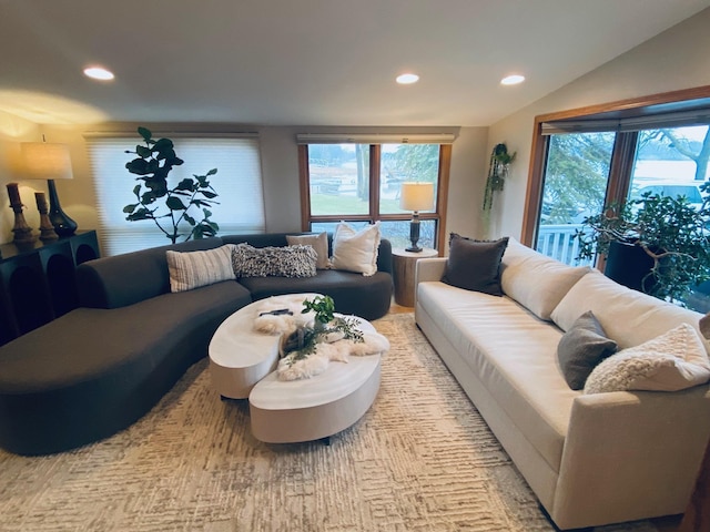 living room with recessed lighting, lofted ceiling, and a healthy amount of sunlight