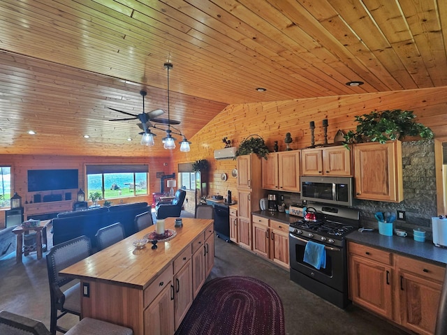 49818 Long Lake Trl, Bigfork, MN 56628 - kitchen with range with gas cooktop, stainless steel microwave, wooden ceiling, vaulted ceiling, and butcher block countertops